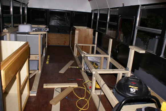 Wood cabinetry being built into the bus