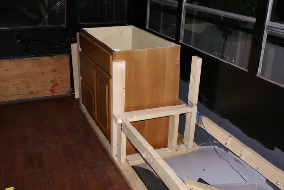 Wood cabinetry being built into the bus