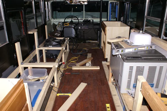 Galley framing inside the bus with the fridge, sink and cooler fitted
