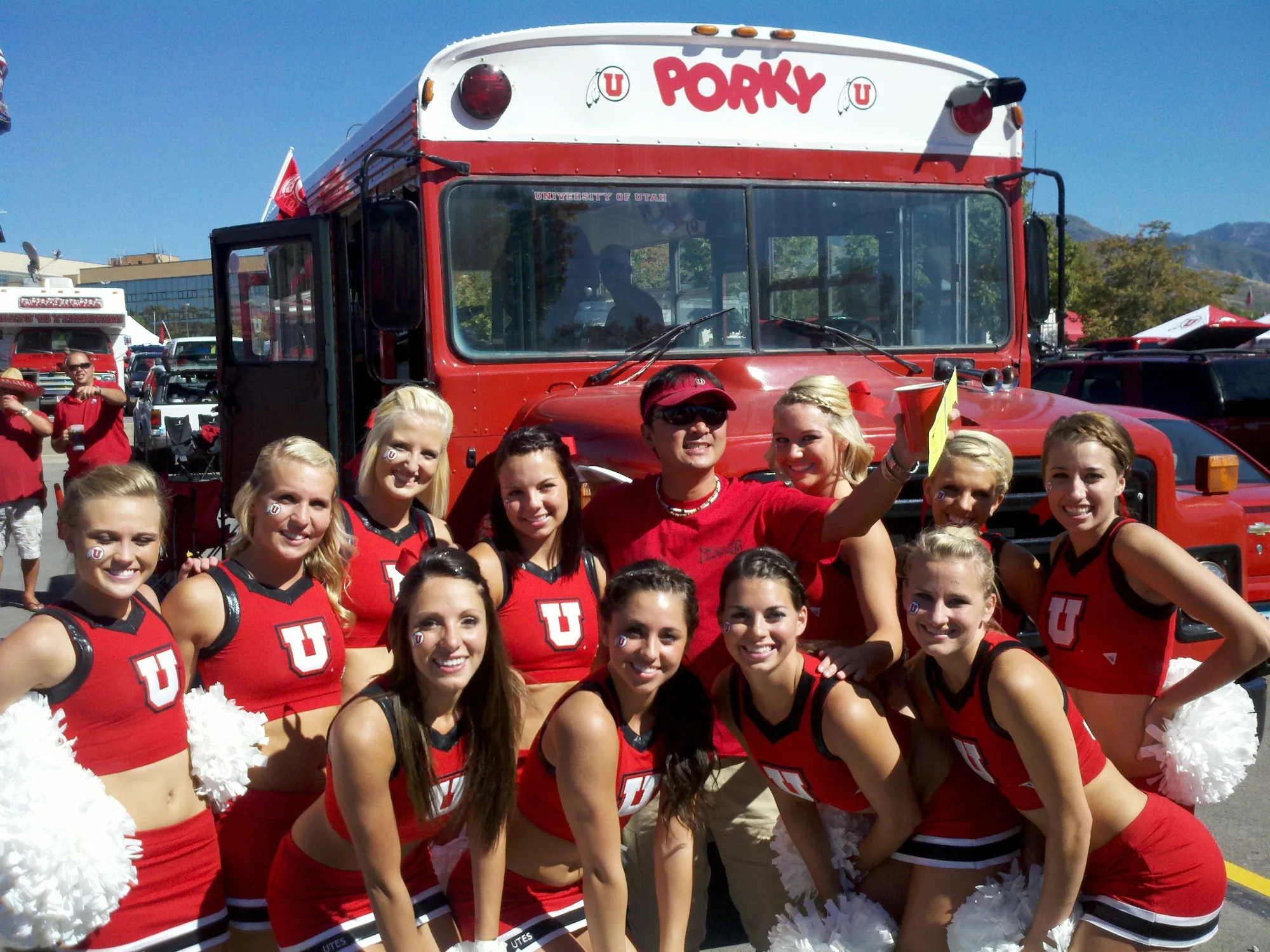 Utah cheerleaders and the crew posing in front of Porky