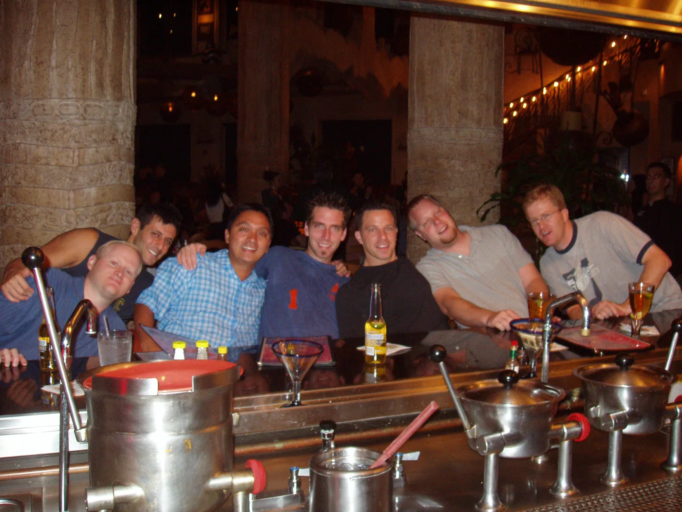 The crew lined up along a long restaurant table