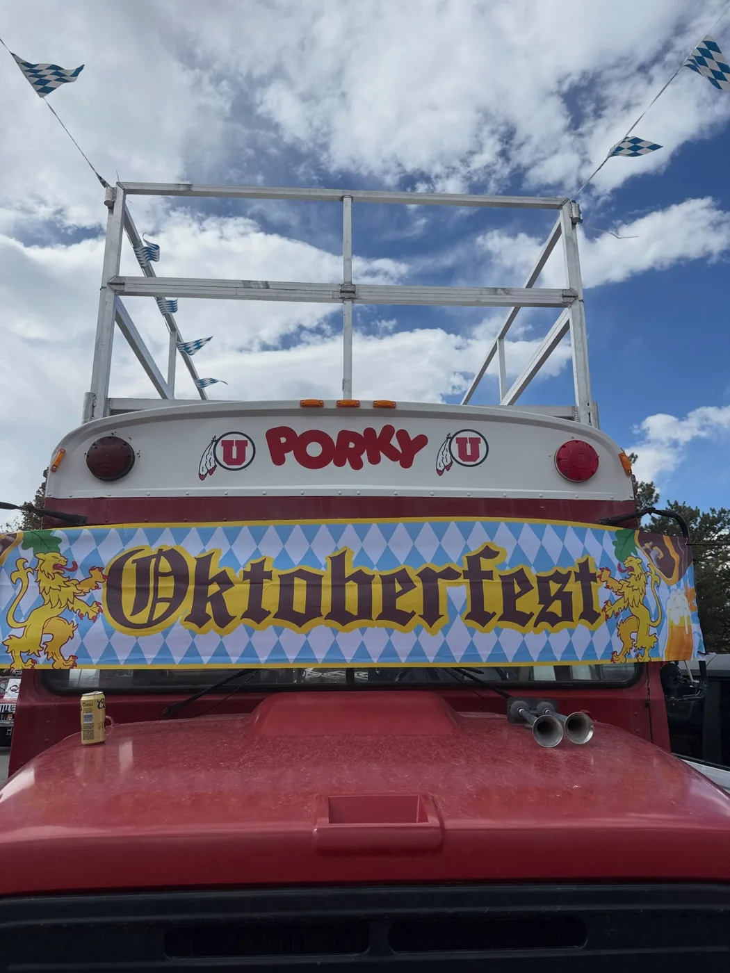 Porky’s front with an Oktoberfest banner across the windshield and the roof deck above
